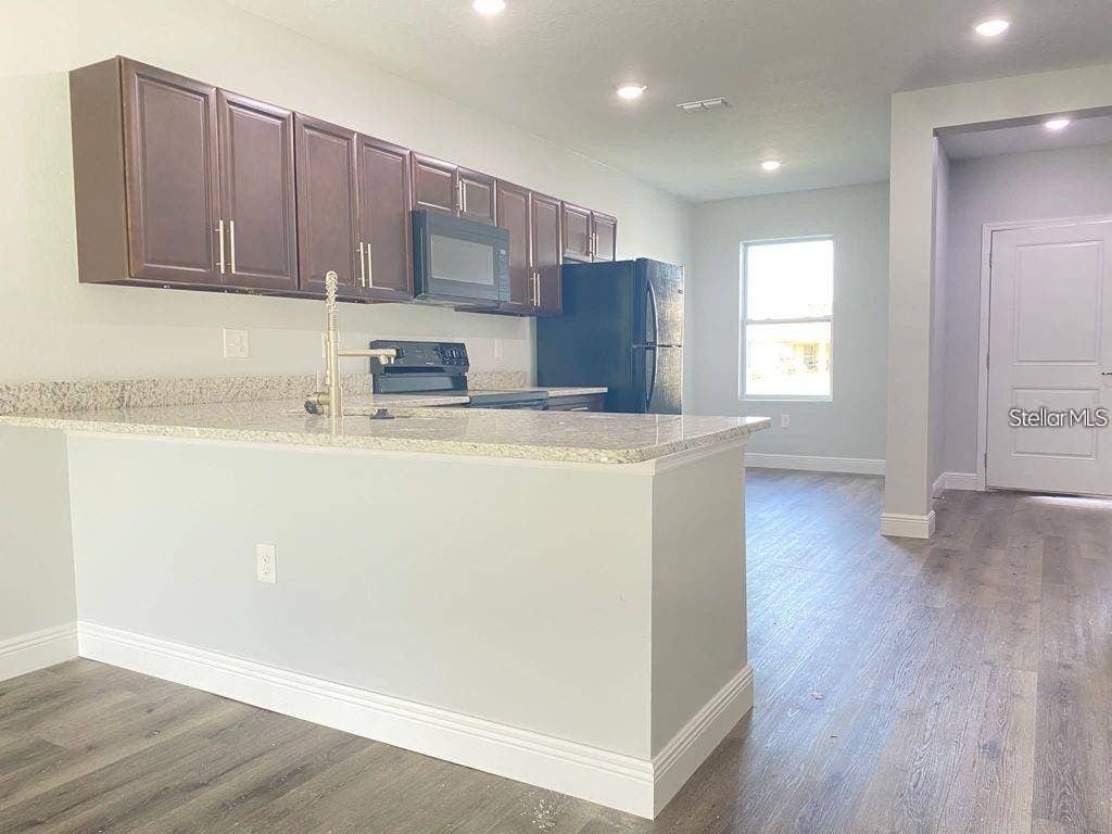 363 DUNDEE DRIVE, Poinciana, FL 34759 Original kitchen - front entry view.