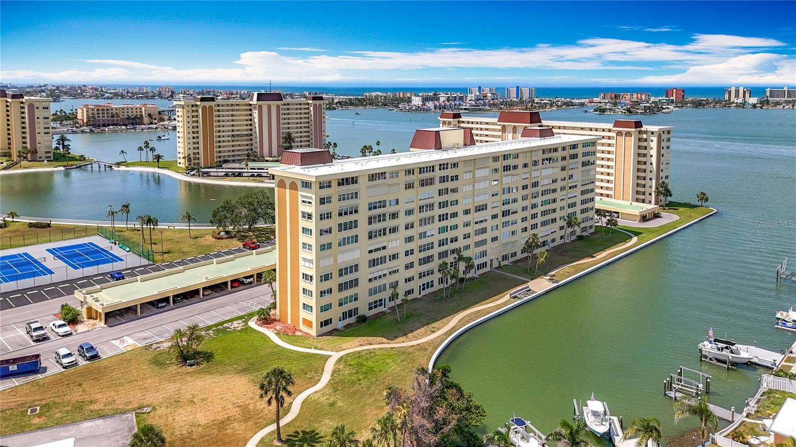 4725 COVE CIRCLE, #908, St Petersburg, FL 33708 Aerial view of the back of the Columbia building and a view of the carports.