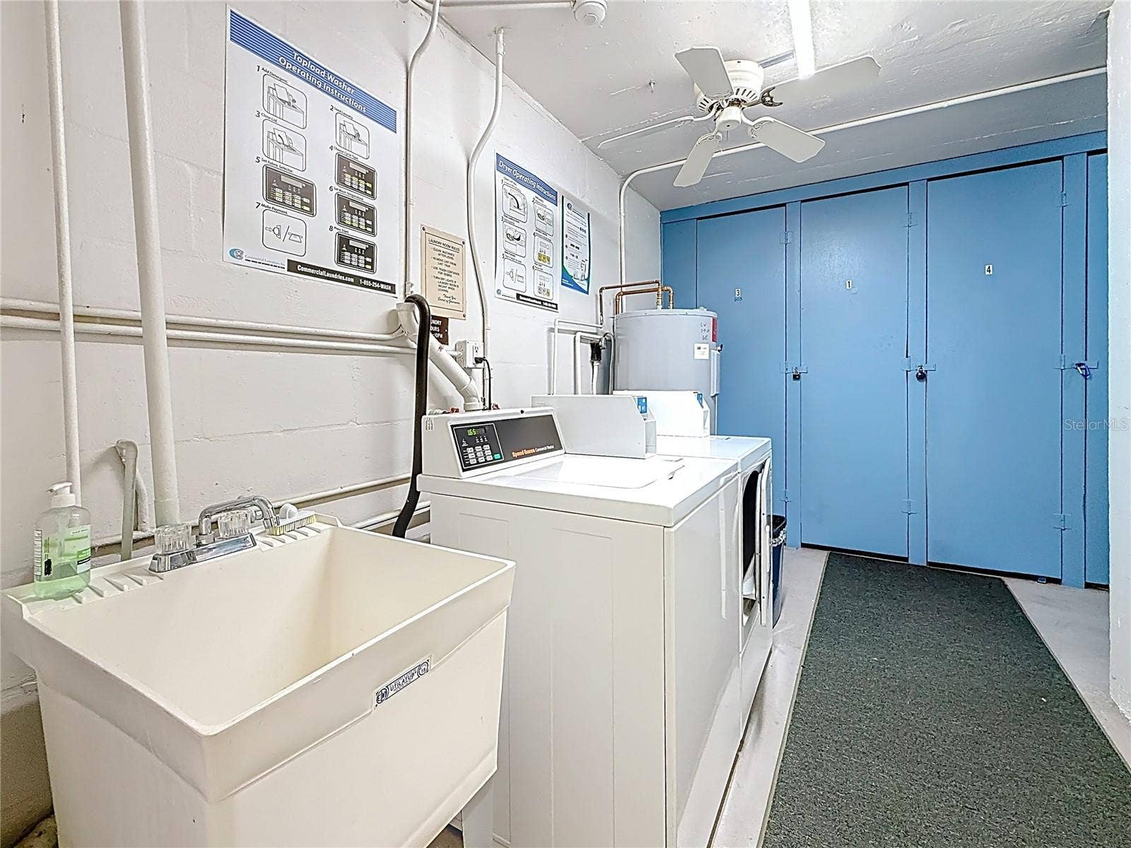 4725 COVE CIRCLE, #908, St Petersburg, FL 33708 This picture shows the laundry area that is location right on the same floor as the unit. There is also a storage room for this unit in thgis area which is right next to the elevators on the same floor