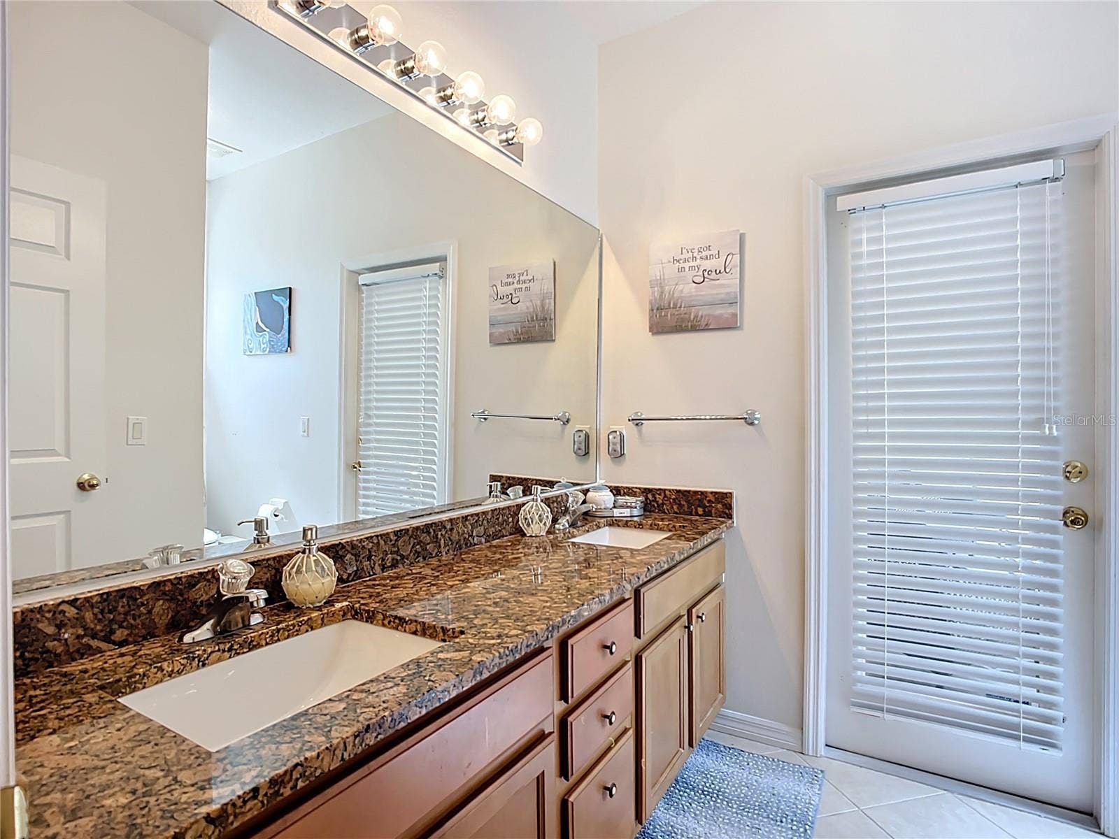 Bathroom 3 with a door to the patio/backyard