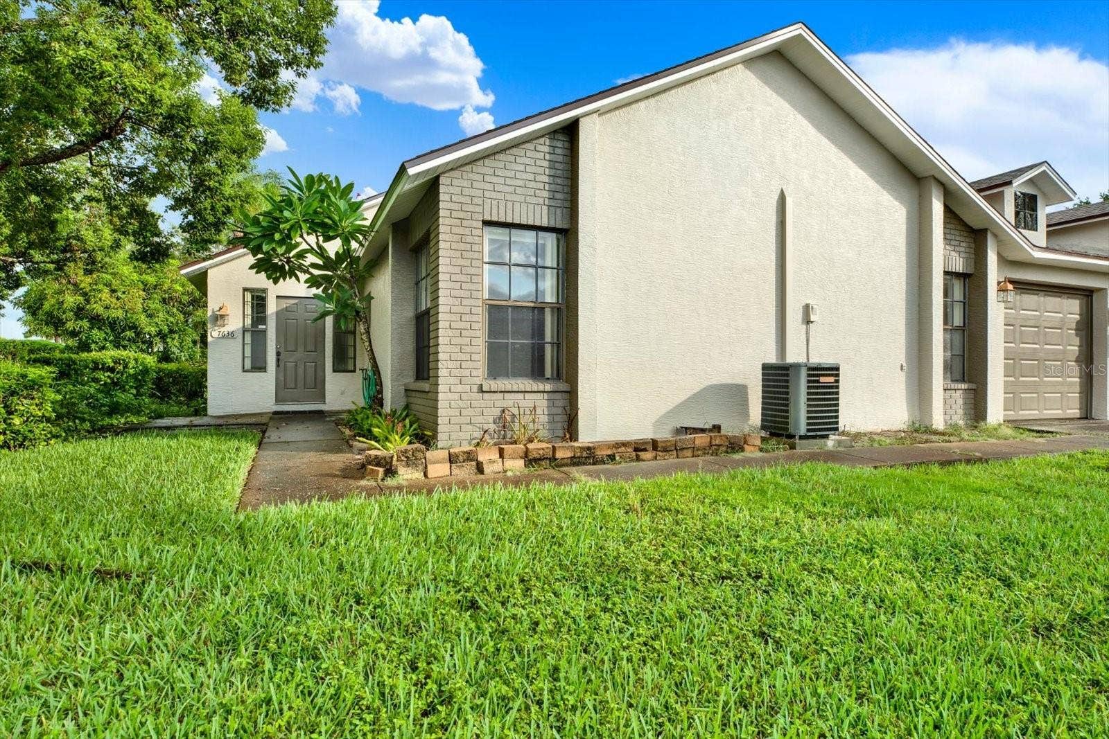 7636 HAIG COURT, New Port Richey, FL 34654 Front exterior of this 2-bedroom, 2-bath villa at 7636 Haig Court in Ruxton Village, New Port Richey. New roof installed May 2026.