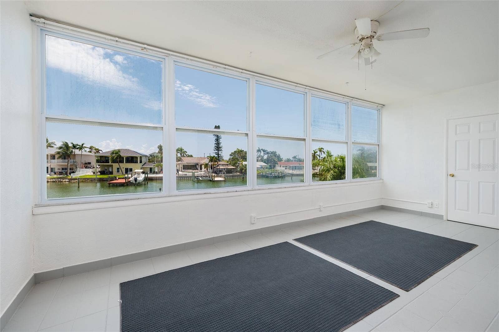 1893 SHORE DRIVE S, #209, South Pasadena, FL 33707 Florida Room w/Storage closet. 21' x 9'. Faces SE.