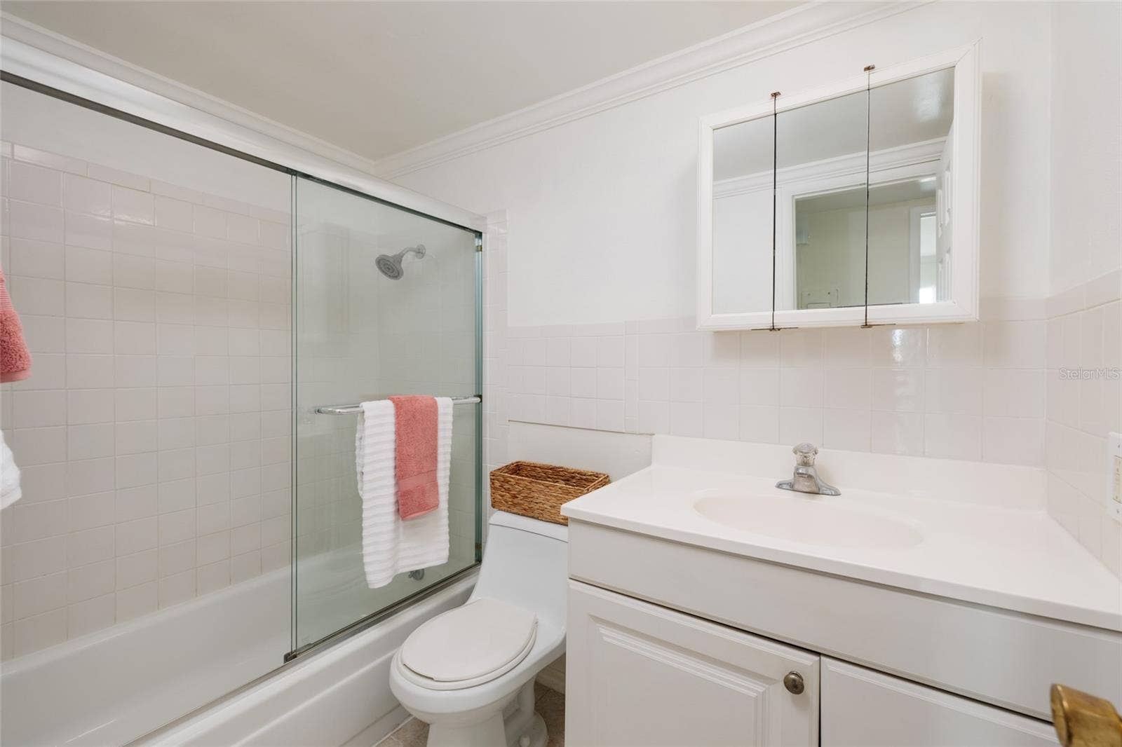 1893 SHORE DRIVE S, #209, South Pasadena, FL 33707 Bathroom w/GFCI outlet, exhaust fan & Crown molding.