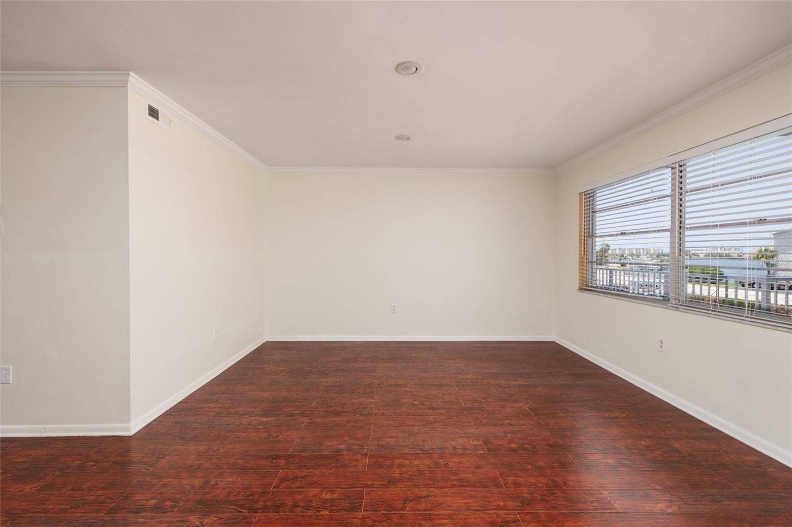 1893 SHORE DRIVE S, #209, South Pasadena, FL 33707 Living Room w/Crown Molding, recessed lighting & Bay views. 18' x 13'.