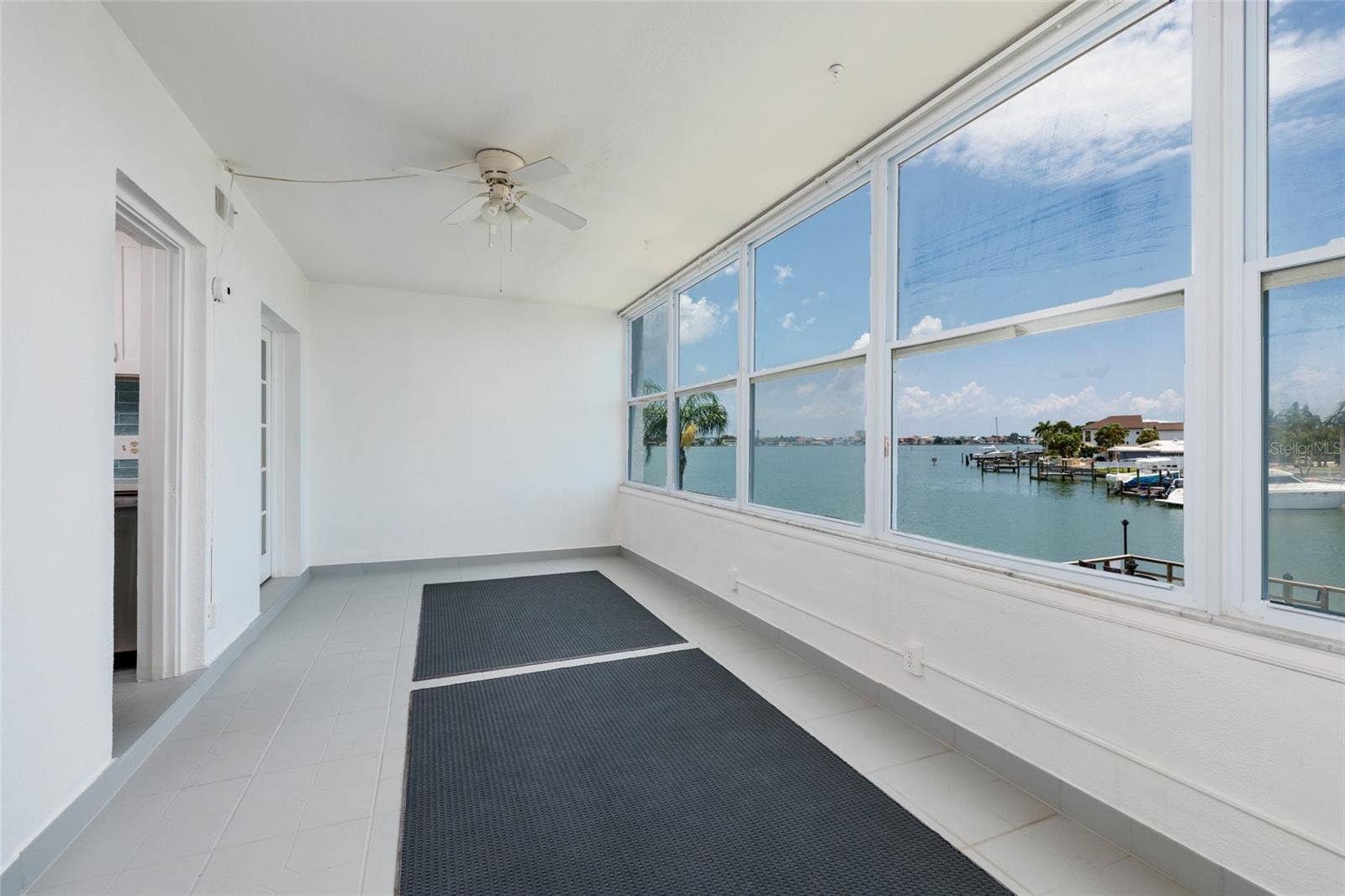 1893 SHORE DRIVE S, #209, South Pasadena, FL 33707 Florida Room w/Double pane windows. 21' x 9'. Boca Ciega Bay views.