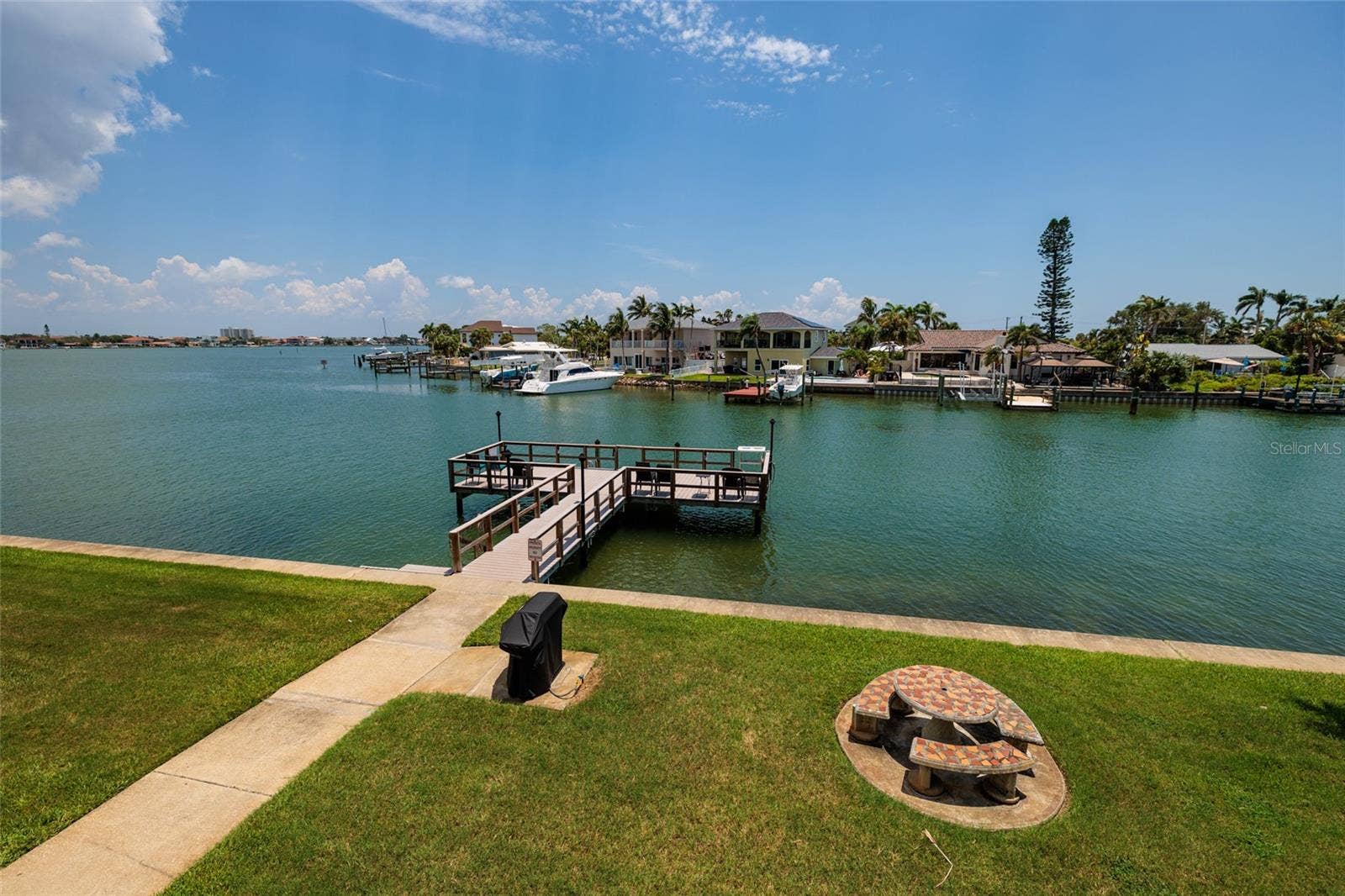 1893 SHORE DRIVE S, #209, South Pasadena, FL 33707 Florida Room views of grilling area, dock & Boca Ciega Bay.