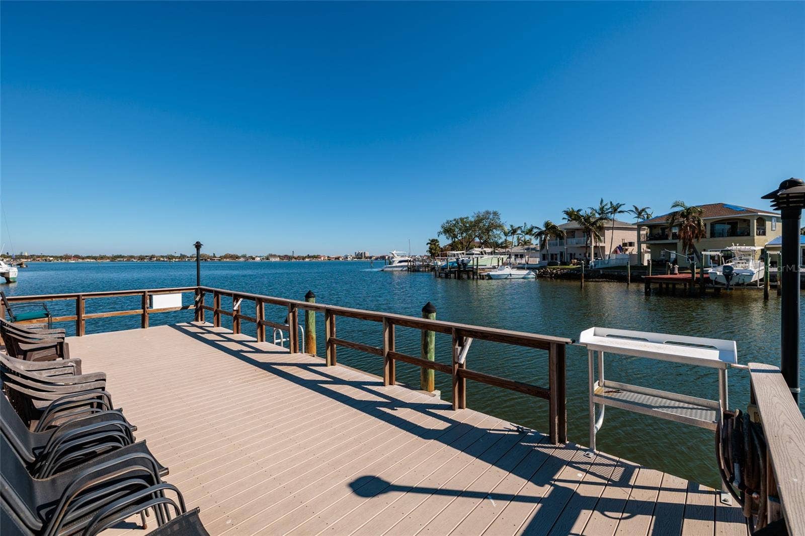 1893 SHORE DRIVE S, #209, South Pasadena, FL 33707 Pier w/Fish cutting table & gate for boat pick up & drop off. Composite deck, water & electric.