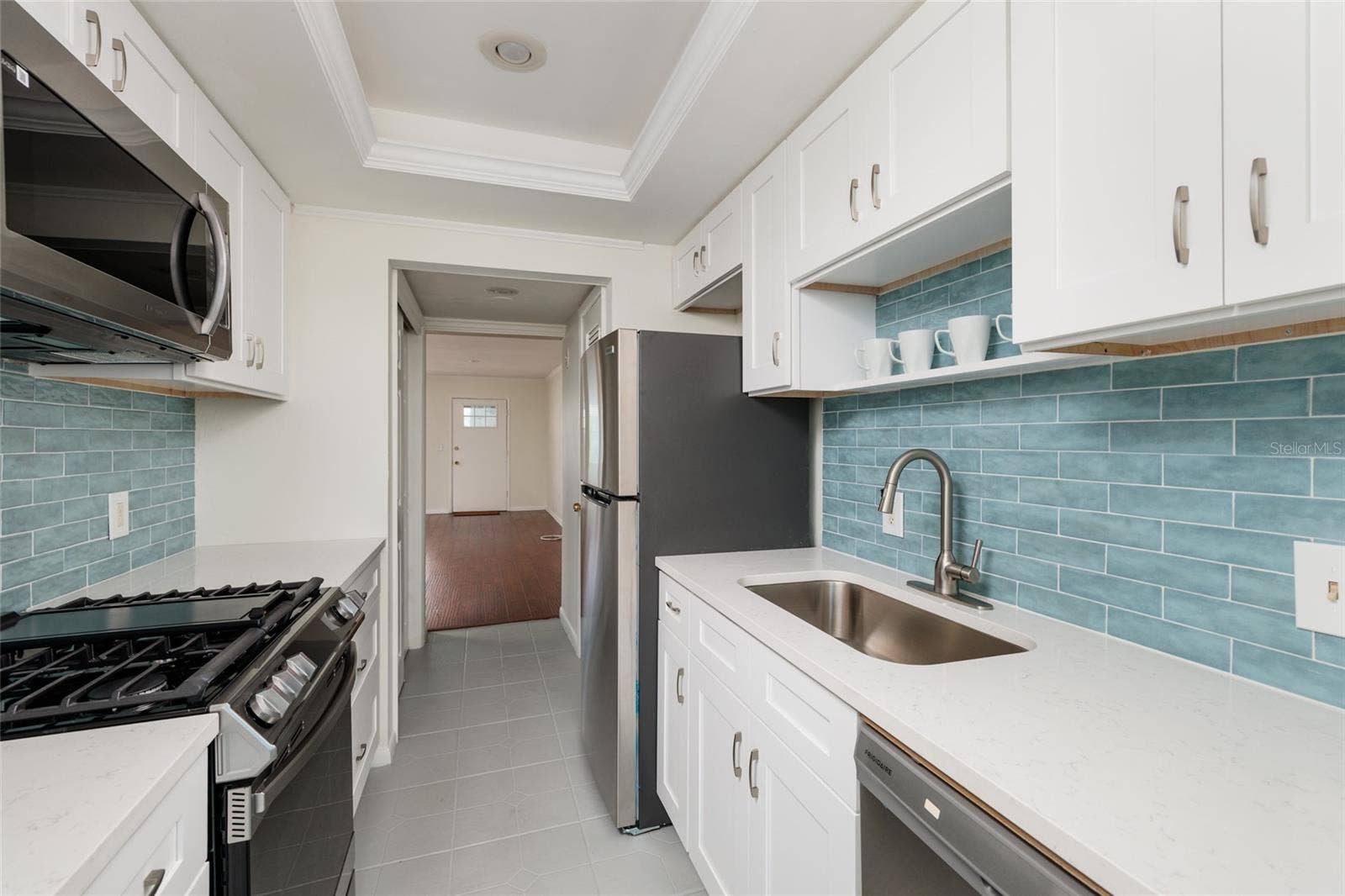 1893 SHORE DRIVE S, #209, South Pasadena, FL 33707 New appliances. Quartz counters. Closet pantry & extra storage closet. Tray ceiling.