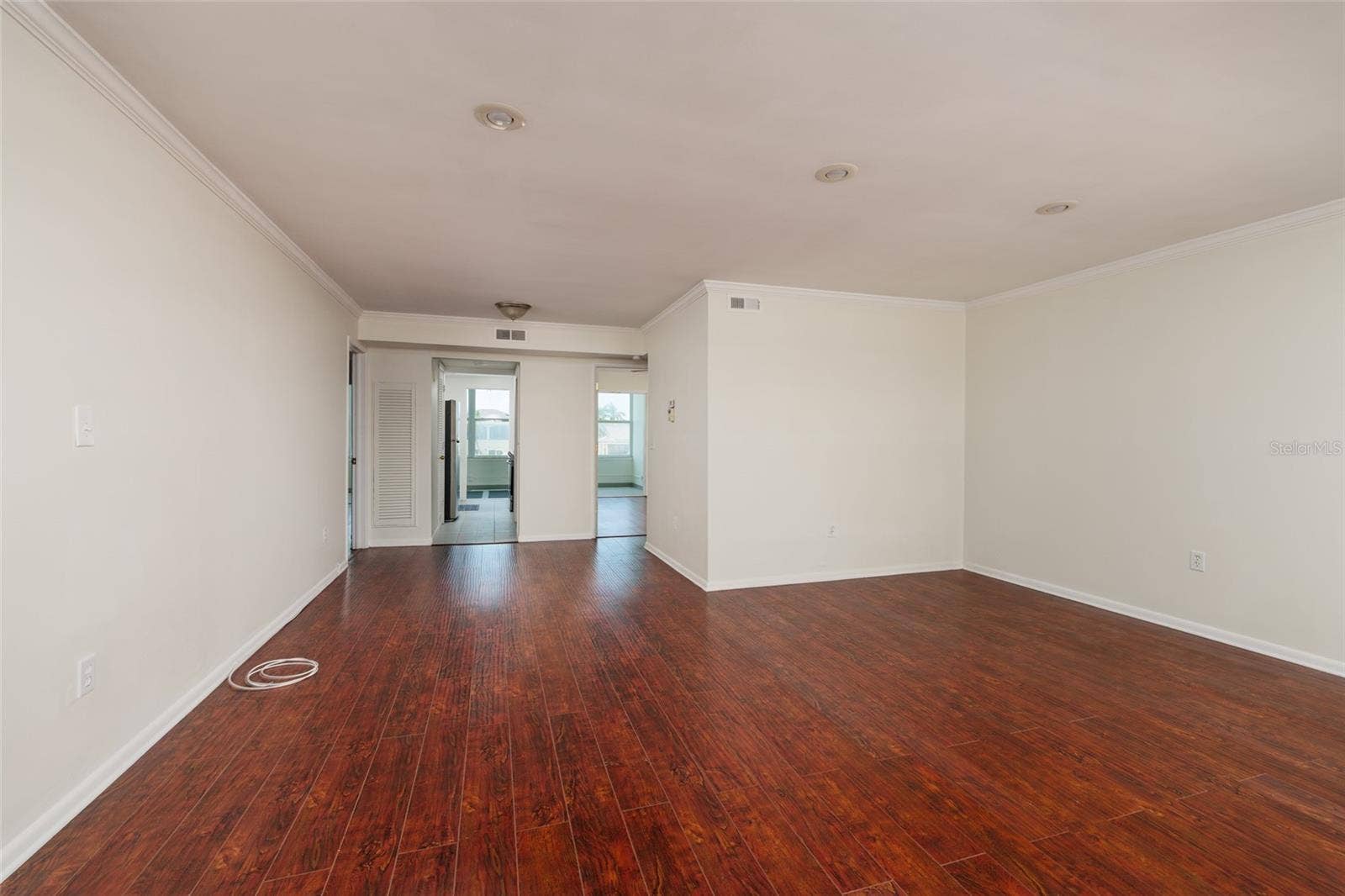 1893 SHORE DRIVE S, #209, South Pasadena, FL 33707 Living & Dining areas: High end laminate flooring & crown molding.