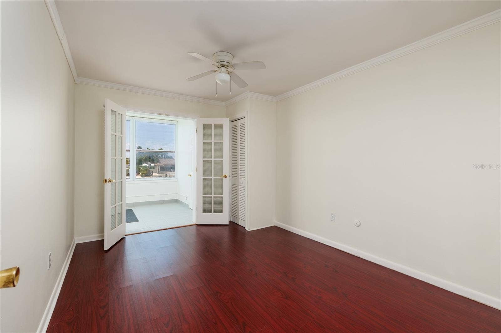 1893 SHORE DRIVE S, #209, South Pasadena, FL 33707 2nd Bedroom: 10' x 13'. Water views, French doors to Florida room. 2 closets.