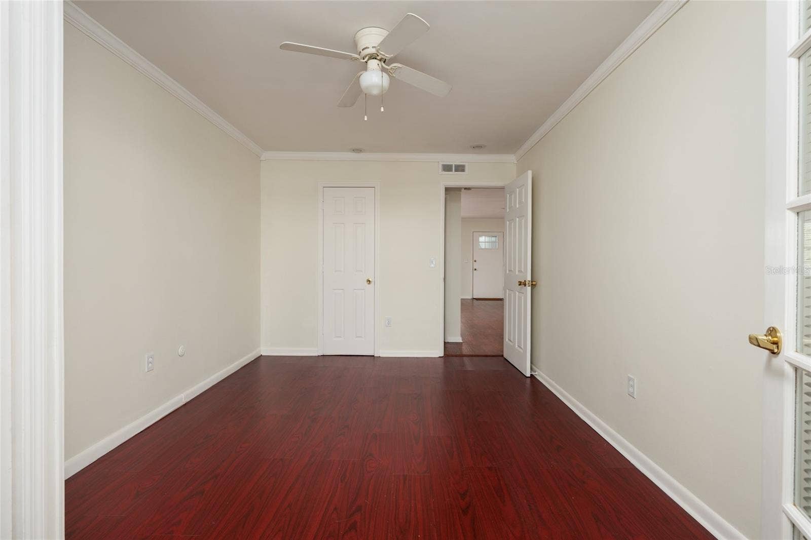 1893 SHORE DRIVE S, #209, South Pasadena, FL 33707 2nd Bedroom: 2 closets (1 with exhaust fan & outlet), Crown molding. Laminate flooring. 10' x 13'.
