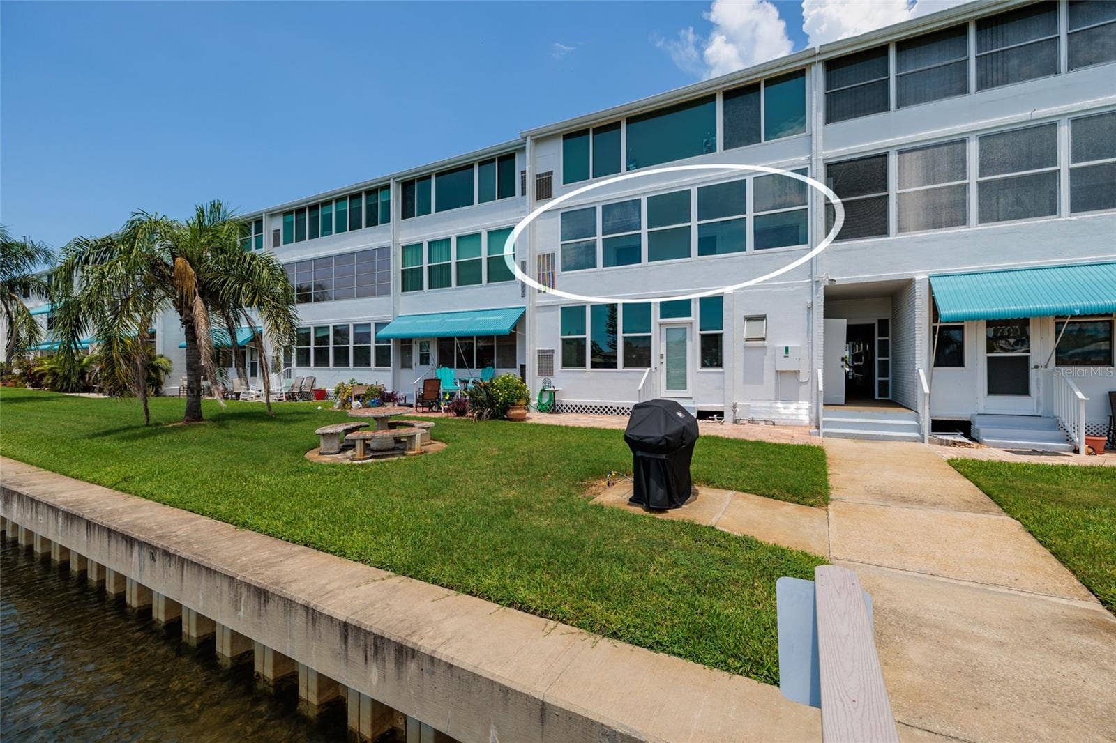 1893 SHORE DRIVE S, #209, South Pasadena, FL 33707 #209. Newer seawall. Bathroom just inside the bldg doorway. Grilling/picnic area.