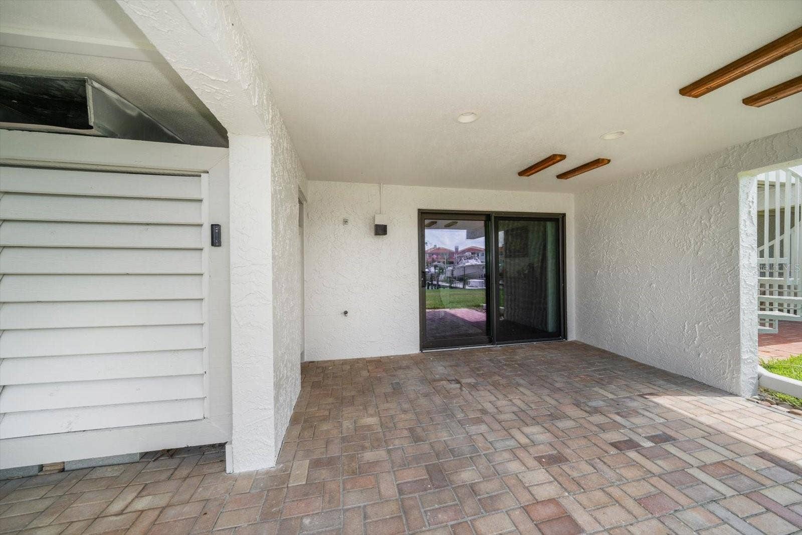 119 MARINA DEL REY COURT, Clearwater Beach, FL 33767 Lots of outdoor living areas for entertaining, with storage for water toys!