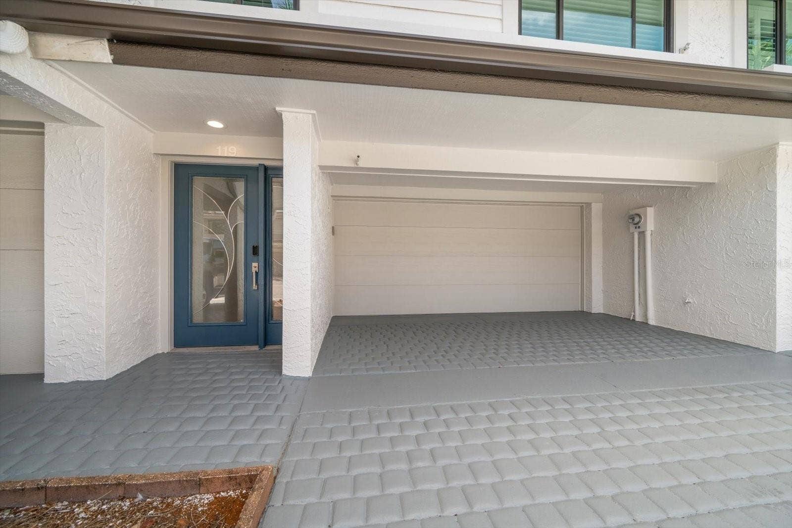 119 MARINA DEL REY COURT, Clearwater Beach, FL 33767 Two car garage and additional parking in driveway.
