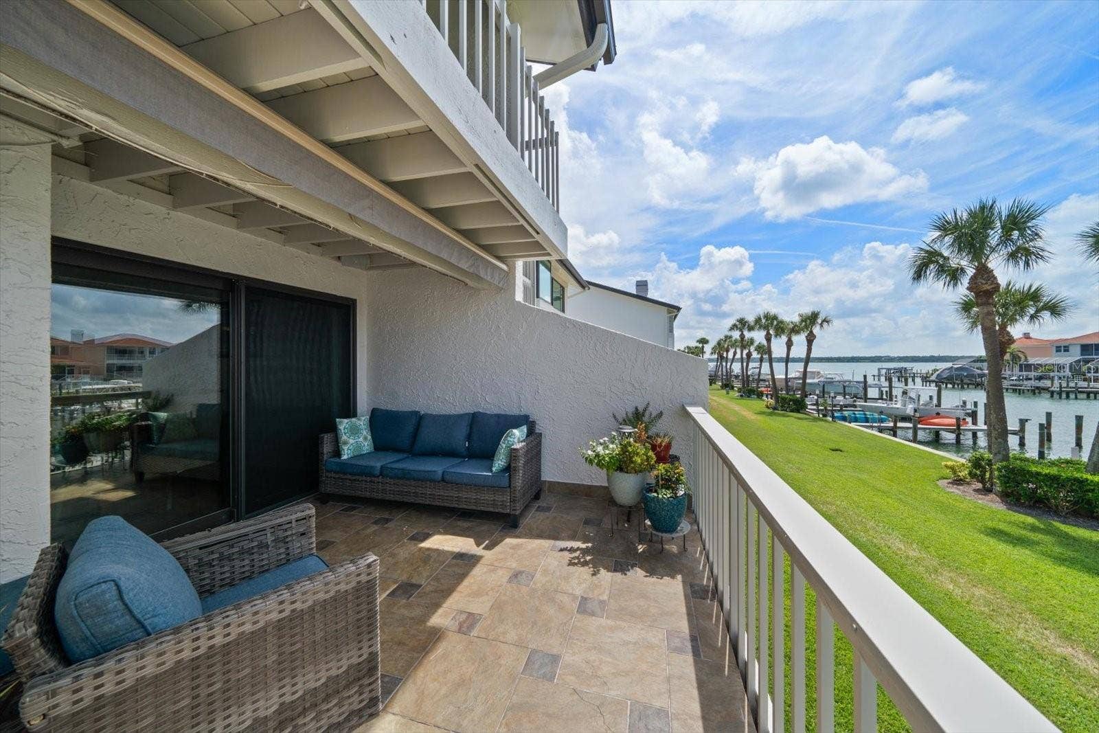119 MARINA DEL REY COURT, Clearwater Beach, FL 33767 Private terrace found off the main level creates an inviting outdoor living space.