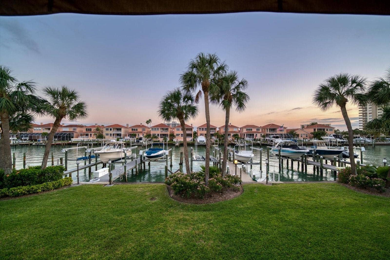 119 MARINA DEL REY COURT, Clearwater Beach, FL 33767 Your boat is at your back door in the private dock and boat slip!
