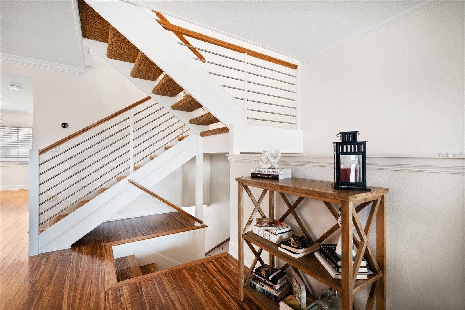 119 MARINA DEL REY COURT, Clearwater Beach, FL 33767 Staircase leads to master and additional bedroom upstairs.
