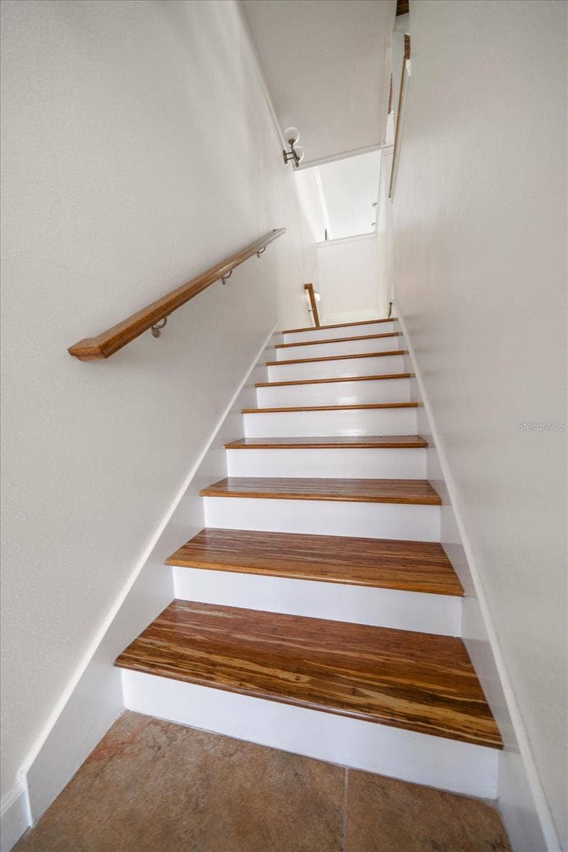 119 MARINA DEL REY COURT, Clearwater Beach, FL 33767 Staircase leading to bonus area on ground level