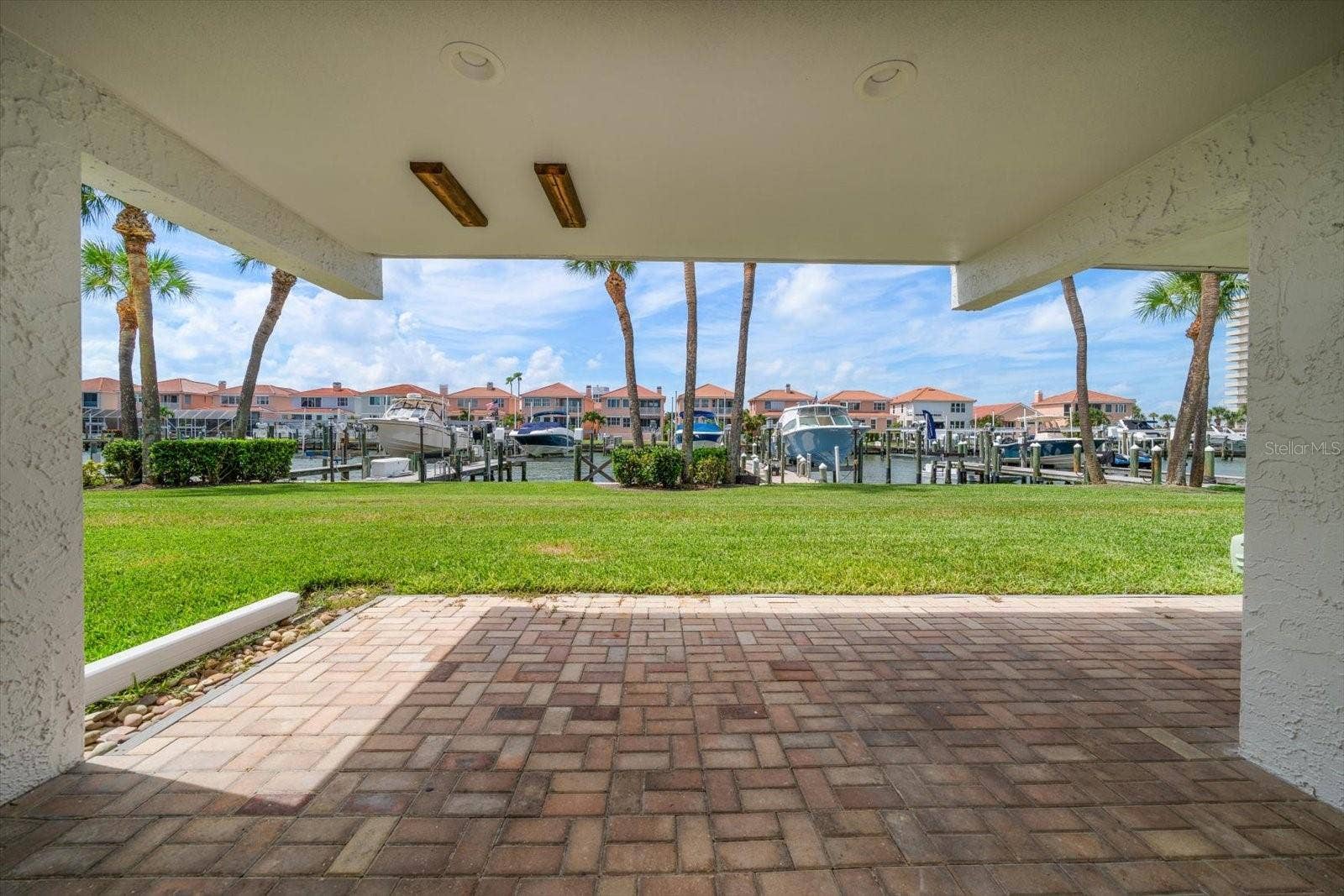 119 MARINA DEL REY COURT, Clearwater Beach, FL 33767 Ground level, private terrace.