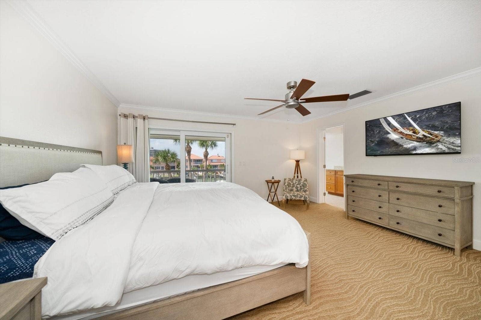 119 MARINA DEL REY COURT, Clearwater Beach, FL 33767 Sanctuary awaits in the primary suite with picturesque views of the water.