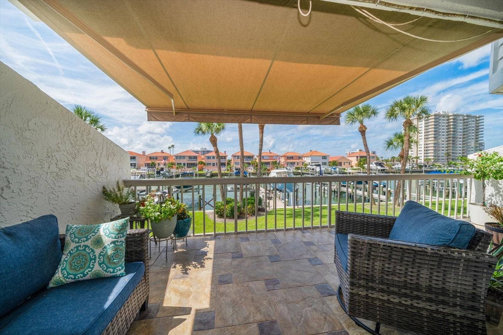 119 MARINA DEL REY COURT, Clearwater Beach, FL 33767 Expansive porch with retractable awning.