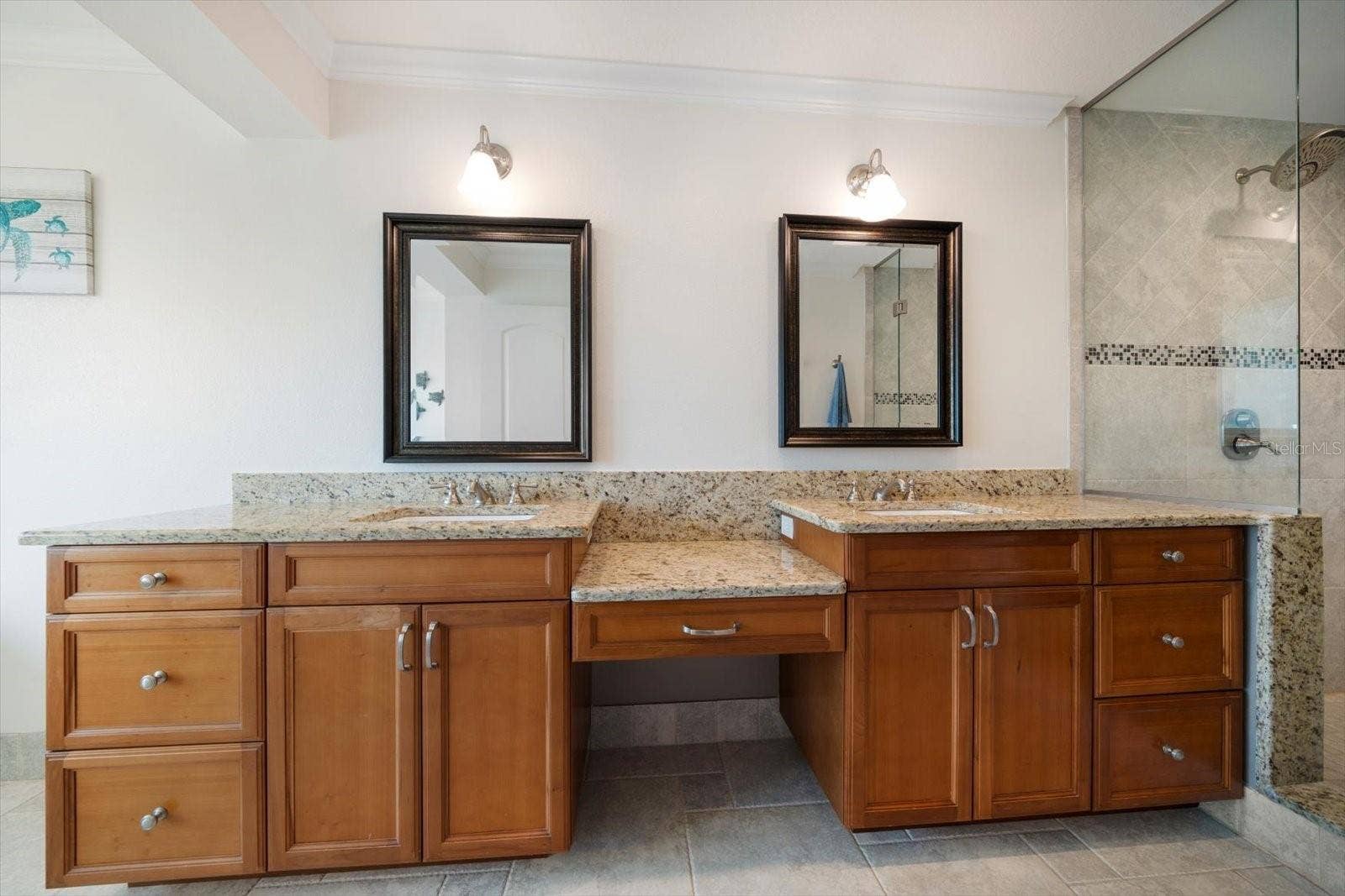 119 MARINA DEL REY COURT, Clearwater Beach, FL 33767 Primary bathroom has dual vanities, walk-in shower.