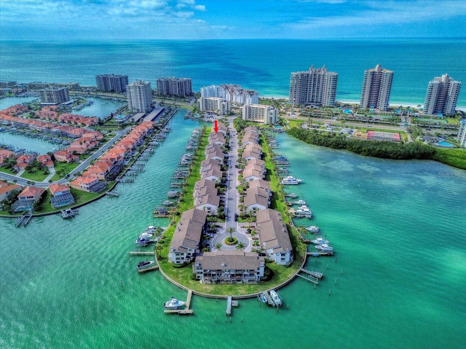 119 MARINA DEL REY COURT, Clearwater Beach, FL 33767 Imagine effortless living in this paradise setting found in Clearwater Beach!
