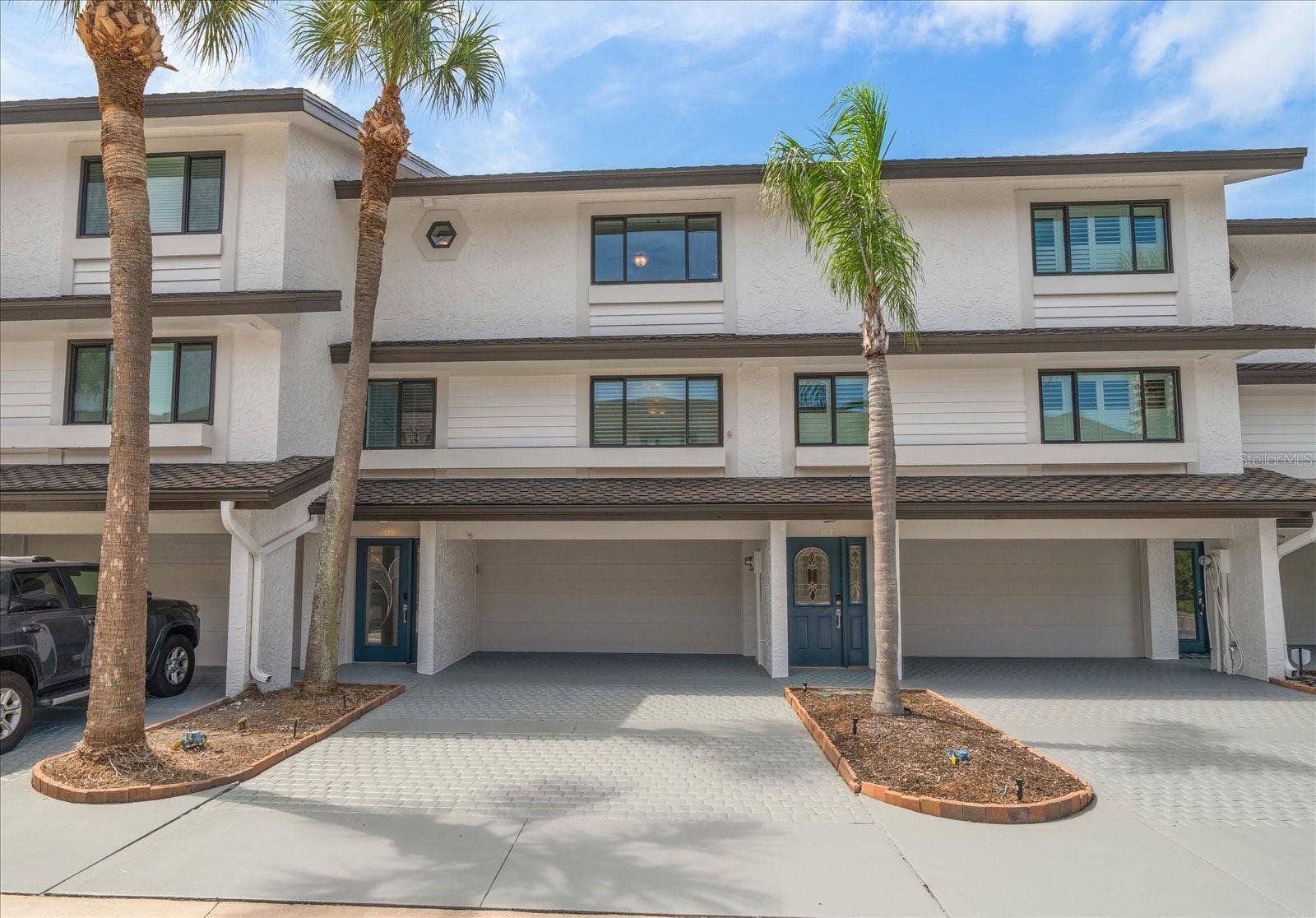 119 MARINA DEL REY COURT, Clearwater Beach, FL 33767 Exceptional multi-level residence offering 3 bedrooms, 3.5 bathrooms, and bonus area!