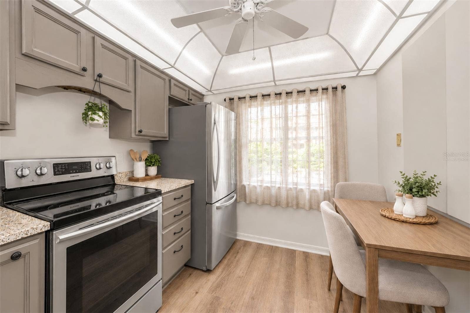 2119 ELM STREET, #103, Dunedin, FL 34698 virtually staged, used the 5k and have kitchen cabinets painted