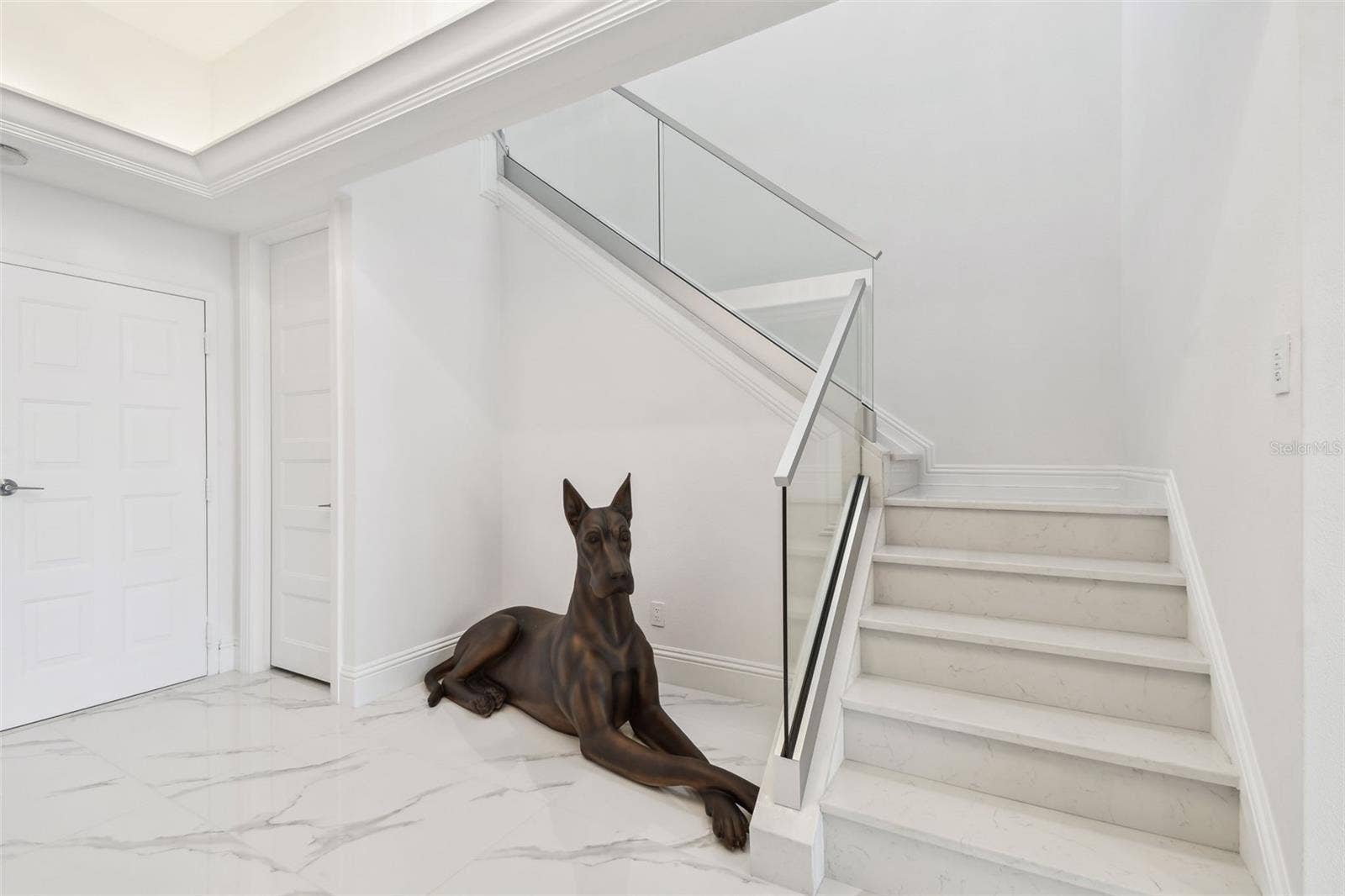 1560 GULF BOULEVARD, #306, Clearwater Beach, FL 33767 Staircase in foyer to upper level