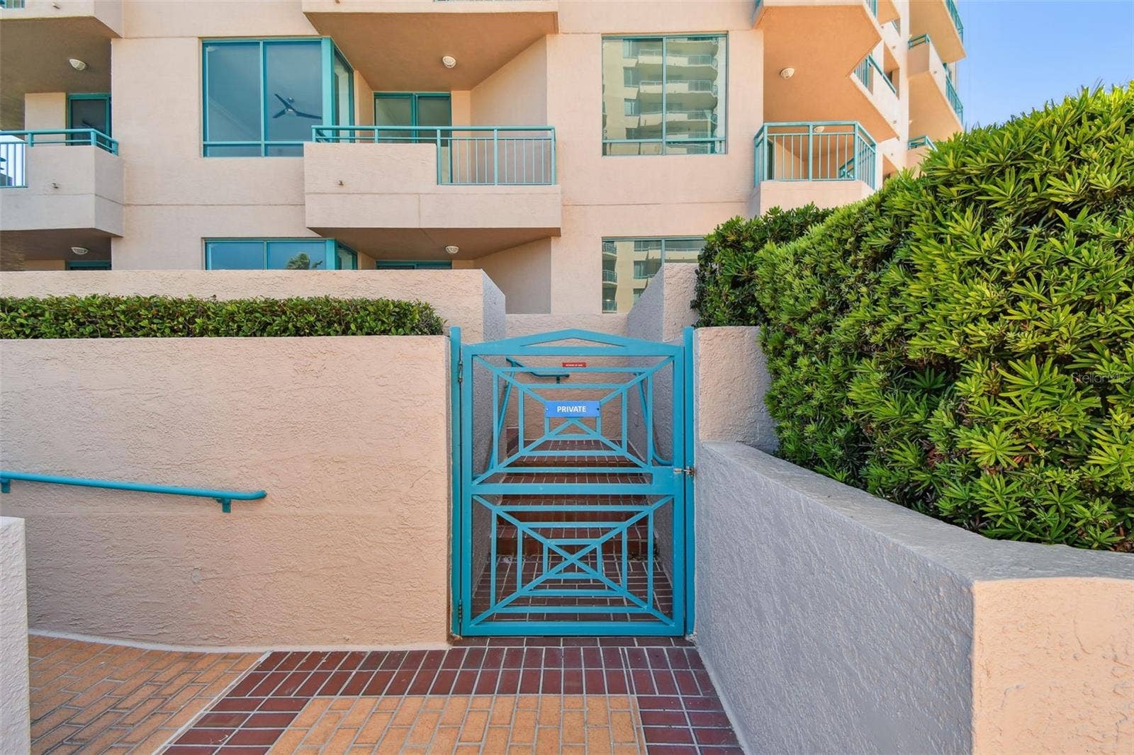 1560 GULF BOULEVARD, #306, Clearwater Beach, FL 33767 Private staircase entrance gate of unit entrance from common areas