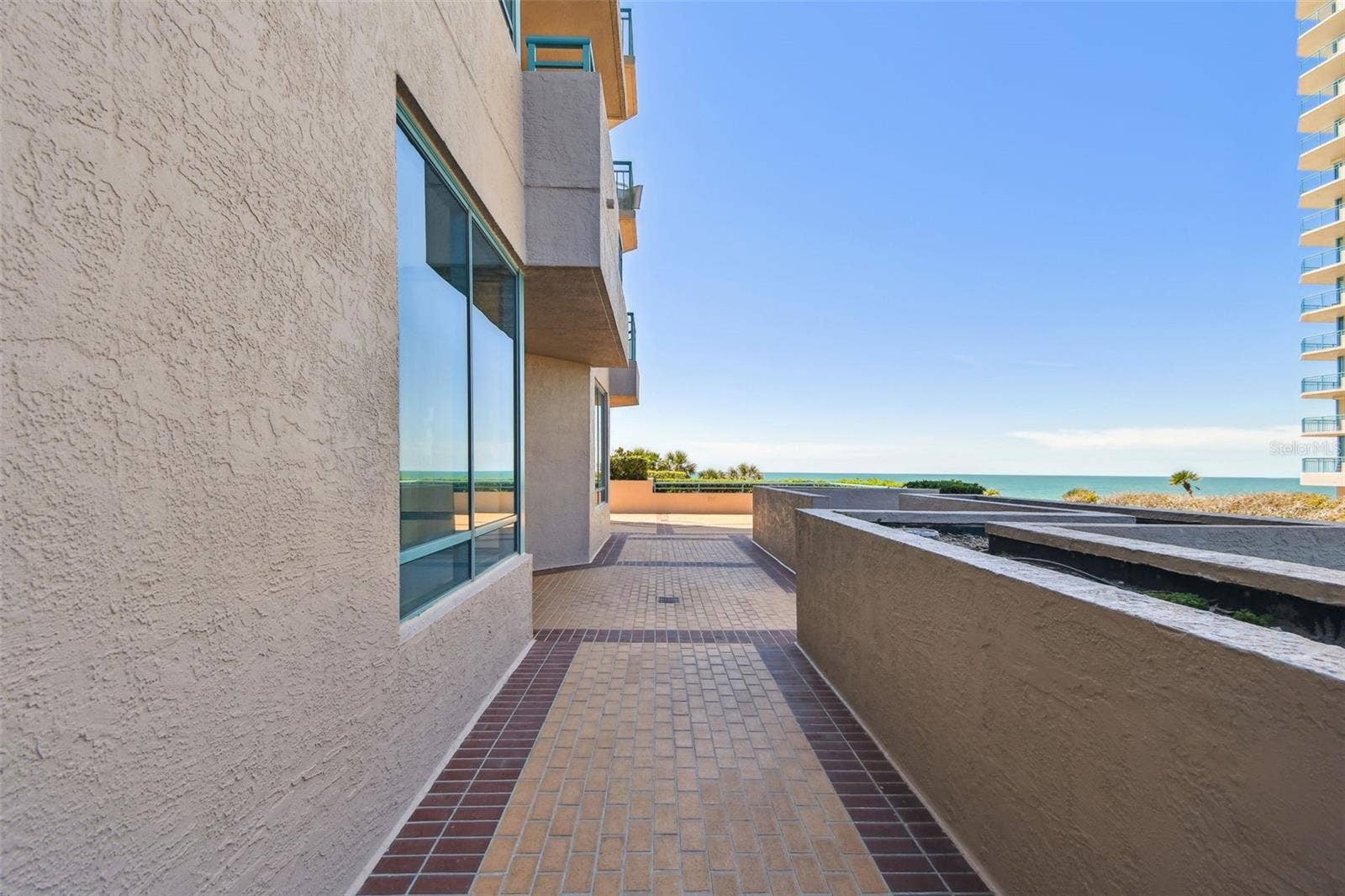 1560 GULF BOULEVARD, #306, Clearwater Beach, FL 33767 Walkway on patio to waterfront section of patio