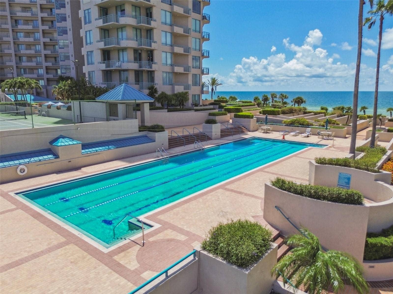 1560 GULF BOULEVARD, #306, Clearwater Beach, FL 33767 Lap pool just off condo patio-Condo in background