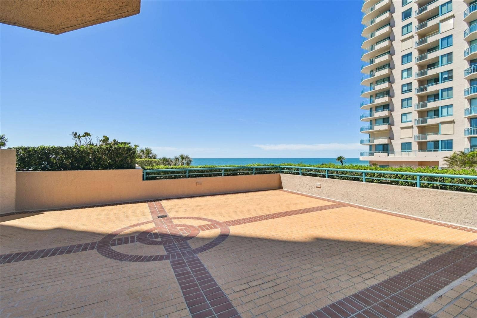 1560 GULF BOULEVARD, #306, Clearwater Beach, FL 33767 Waterfront section of patio overlooking Gulf, Outdoor grill & Firepit areas.