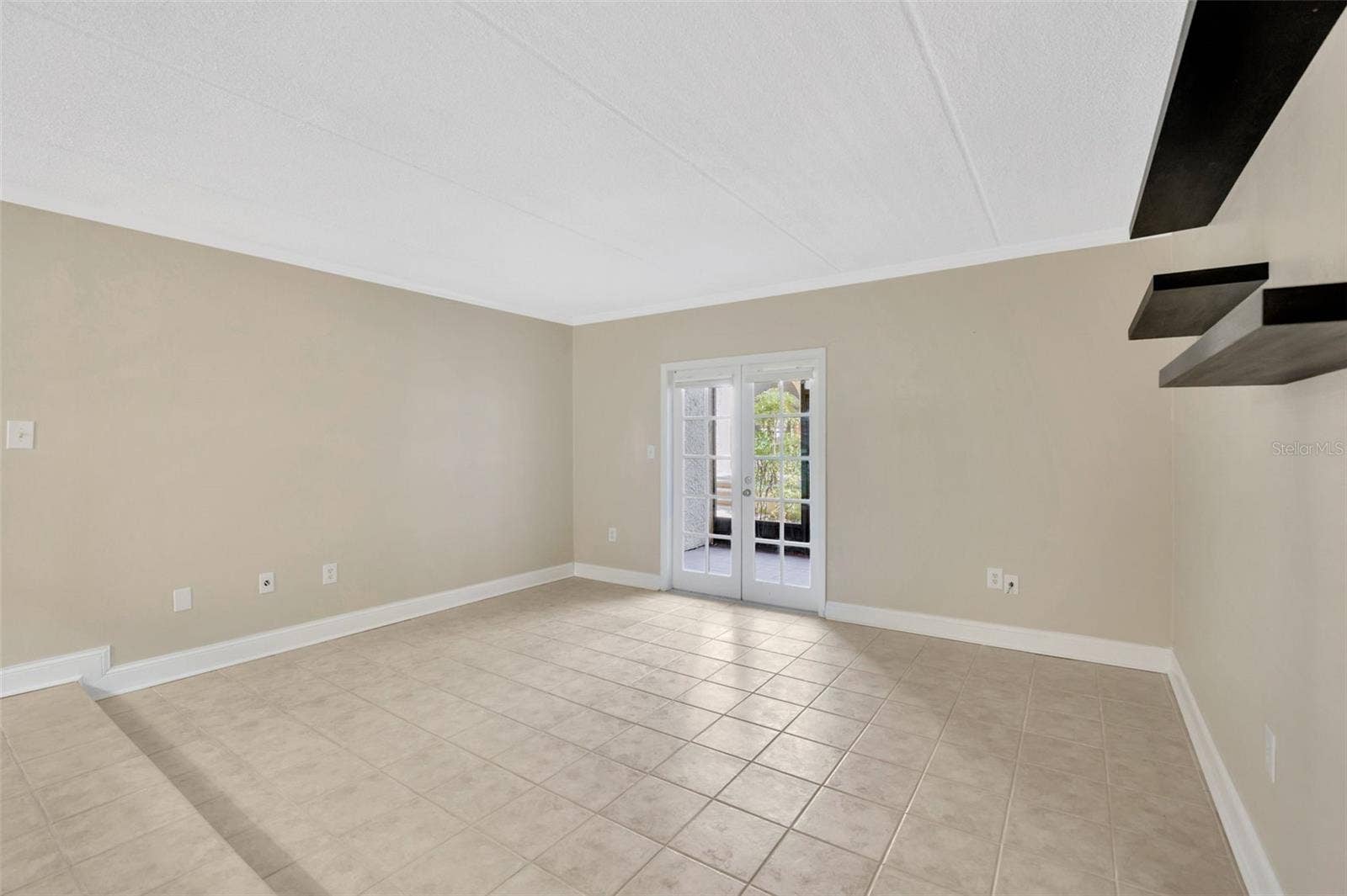 5305 SAN SEBASTIAN COURT, #127, Tampa, FL 33609 Living room from bedroom door