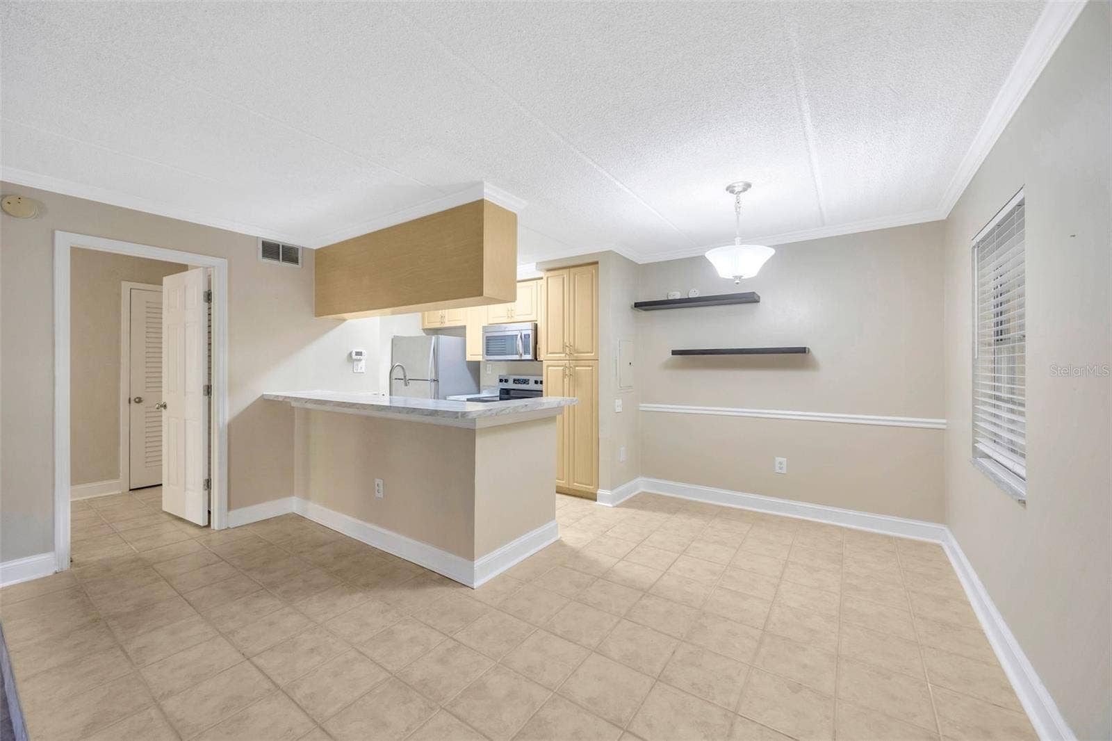 5305 SAN SEBASTIAN COURT, #127, Tampa, FL 33609 Dining space and kitchen