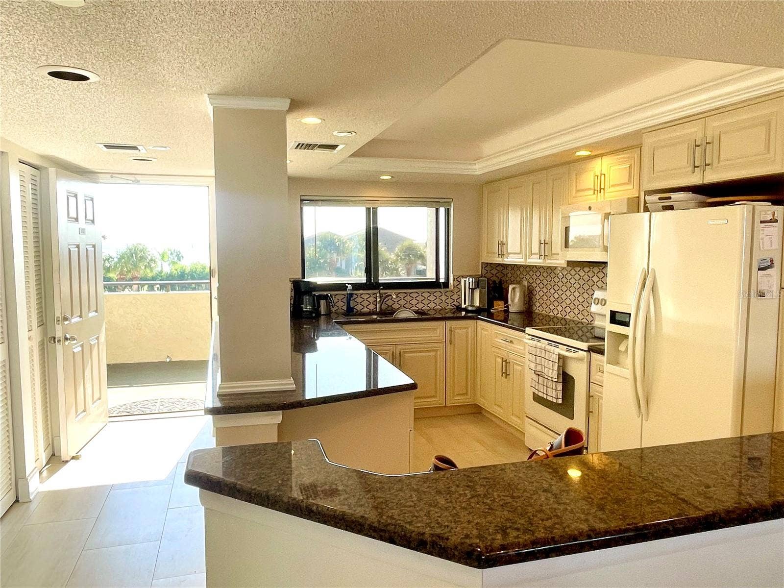 1290 GULF BOULEVARD, #302, Clearwater, FL 33767 Large kitchen with lots of storage and a view of the intracoastal