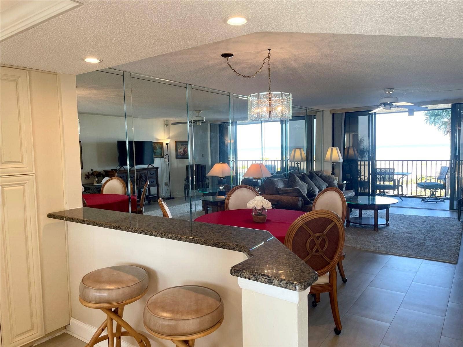 1290 GULF BOULEVARD, #302, Clearwater, FL 33767 Bar seating and dining area