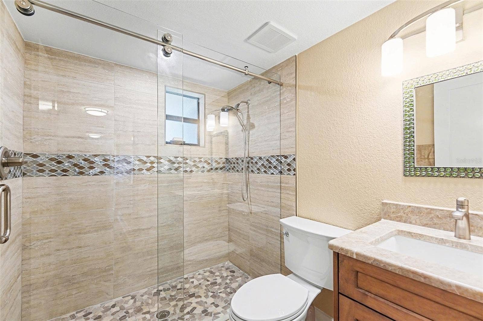 19936 GULF BOULEVARD, Indian Shores, FL 33785 Second bathroom, updated with new countertop, flooring, and paint.