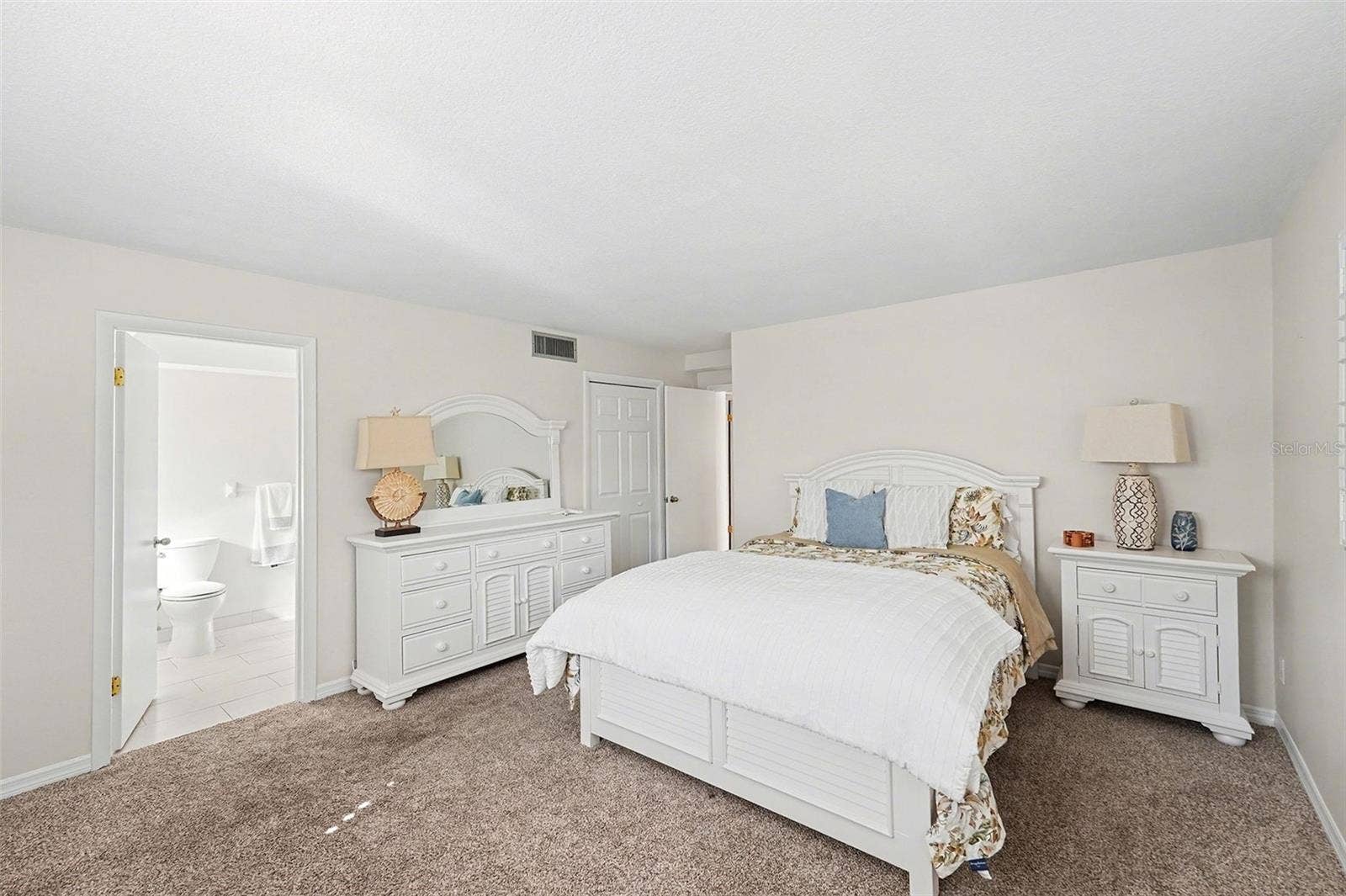 19936 GULF BOULEVARD, Indian Shores, FL 33785 Second level primary bedroom with ensuite bath.