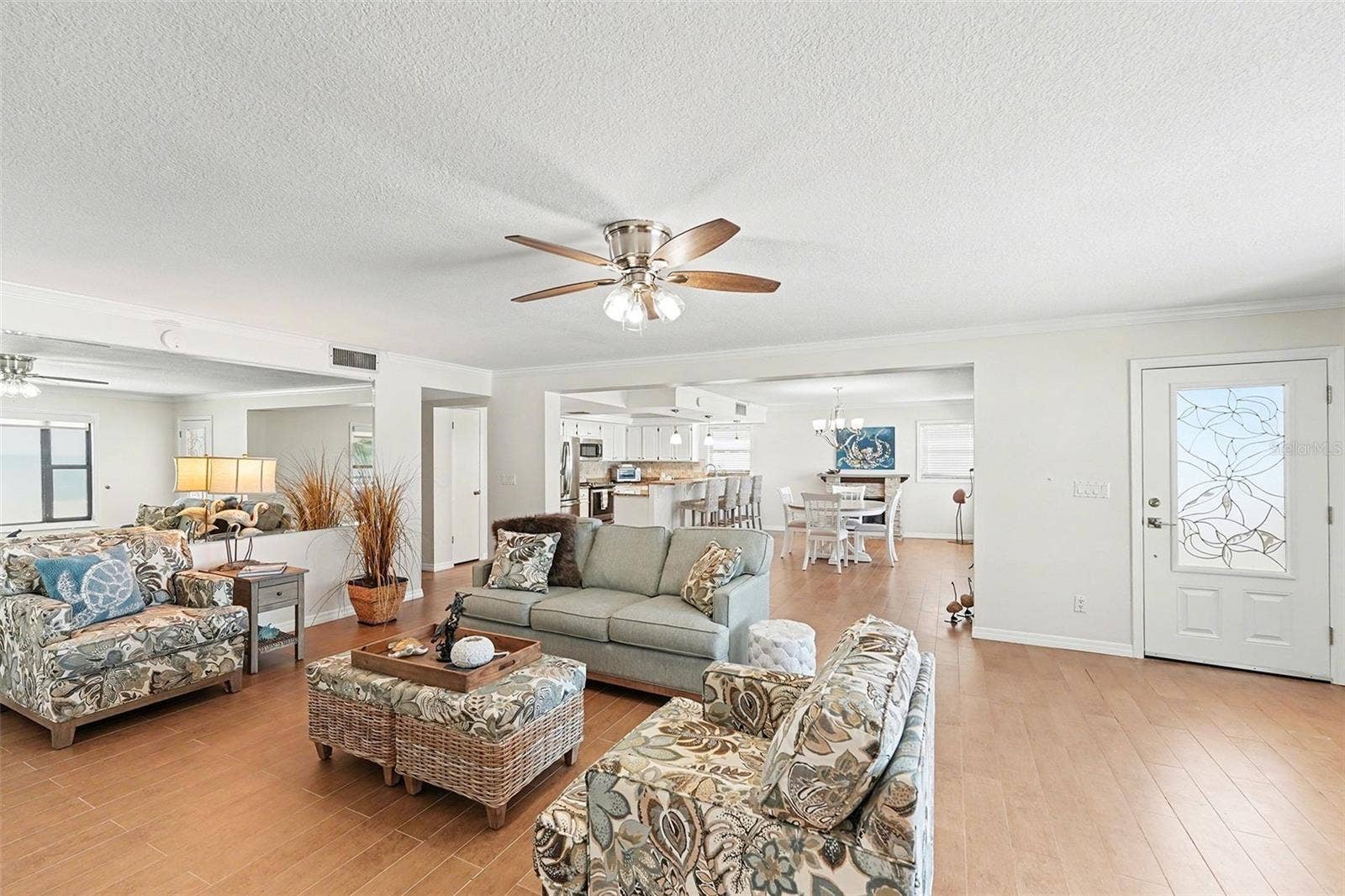 19936 GULF BOULEVARD, Indian Shores, FL 33785 Enjoy the second level with its open design concept with a combined living room, kitchen, large dining room, and fireplace. Large picture windows are in each room with remote shades and frame the beautiful and unique sunsets each evening.