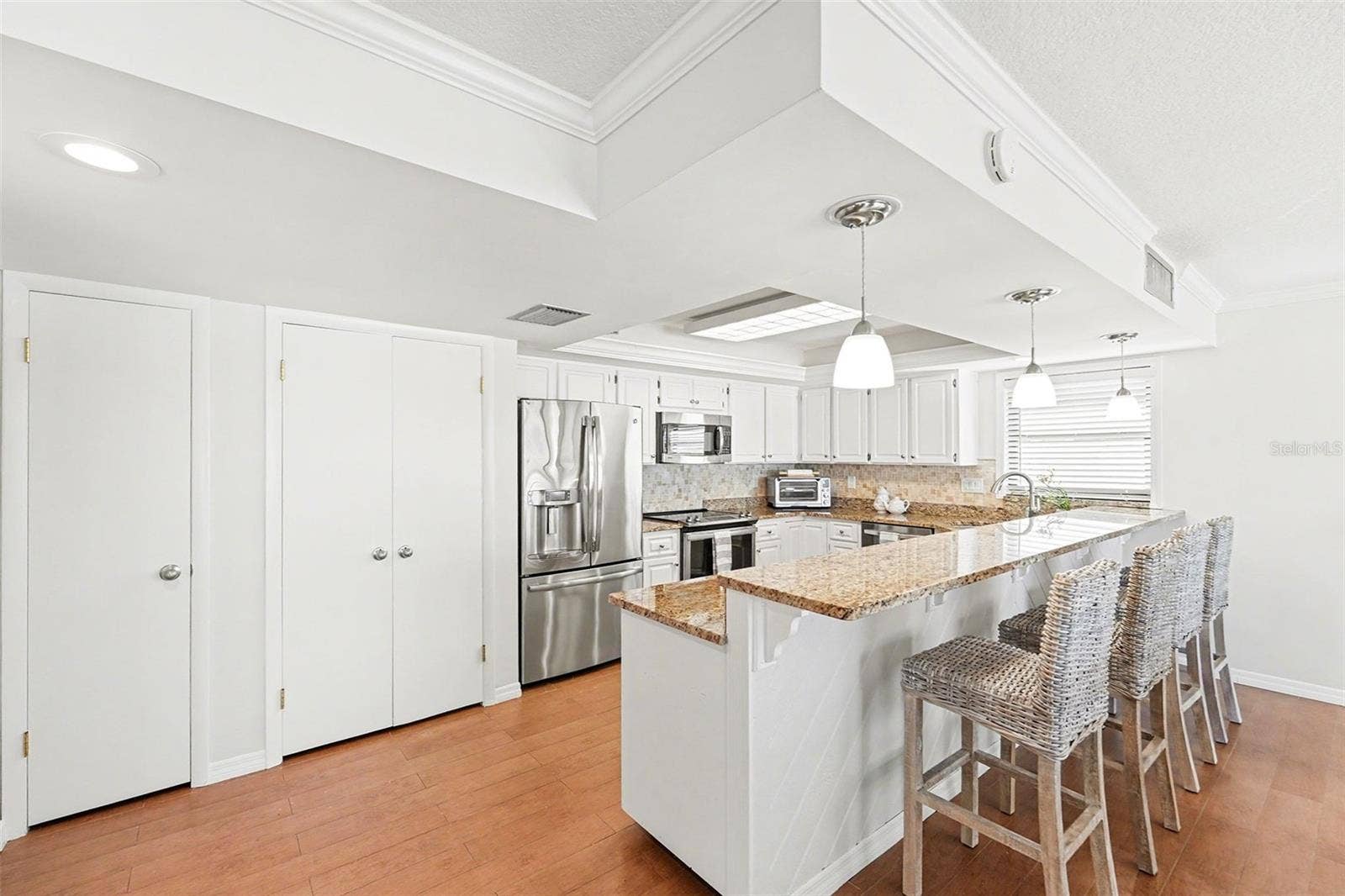 19936 GULF BOULEVARD, Indian Shores, FL 33785 Plenty of storage with large pantry utility closet, and ample kitchen cabinets.