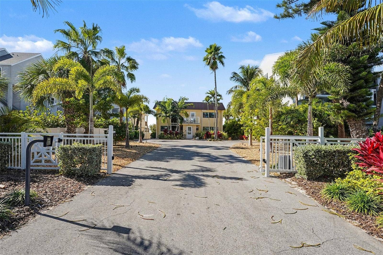 19936 GULF BOULEVARD, Indian Shores, FL 33785 Welcome home through your private remote gate, a single coded entry for pedestrians and a remote coded gate for autos.