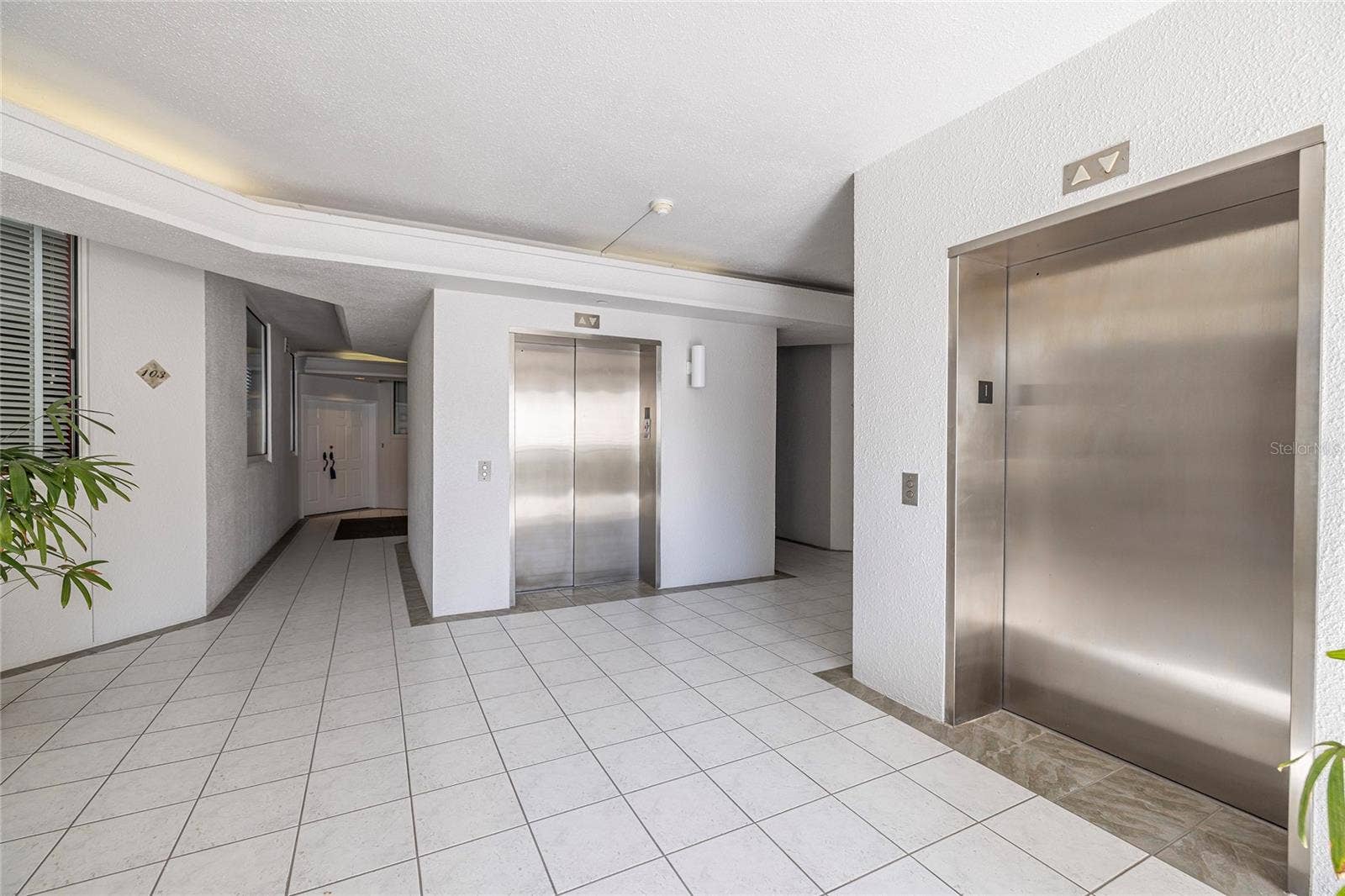 2 SEASIDE LANE, #103, Belleair, FL 33756 Elevators, unit 103 on left