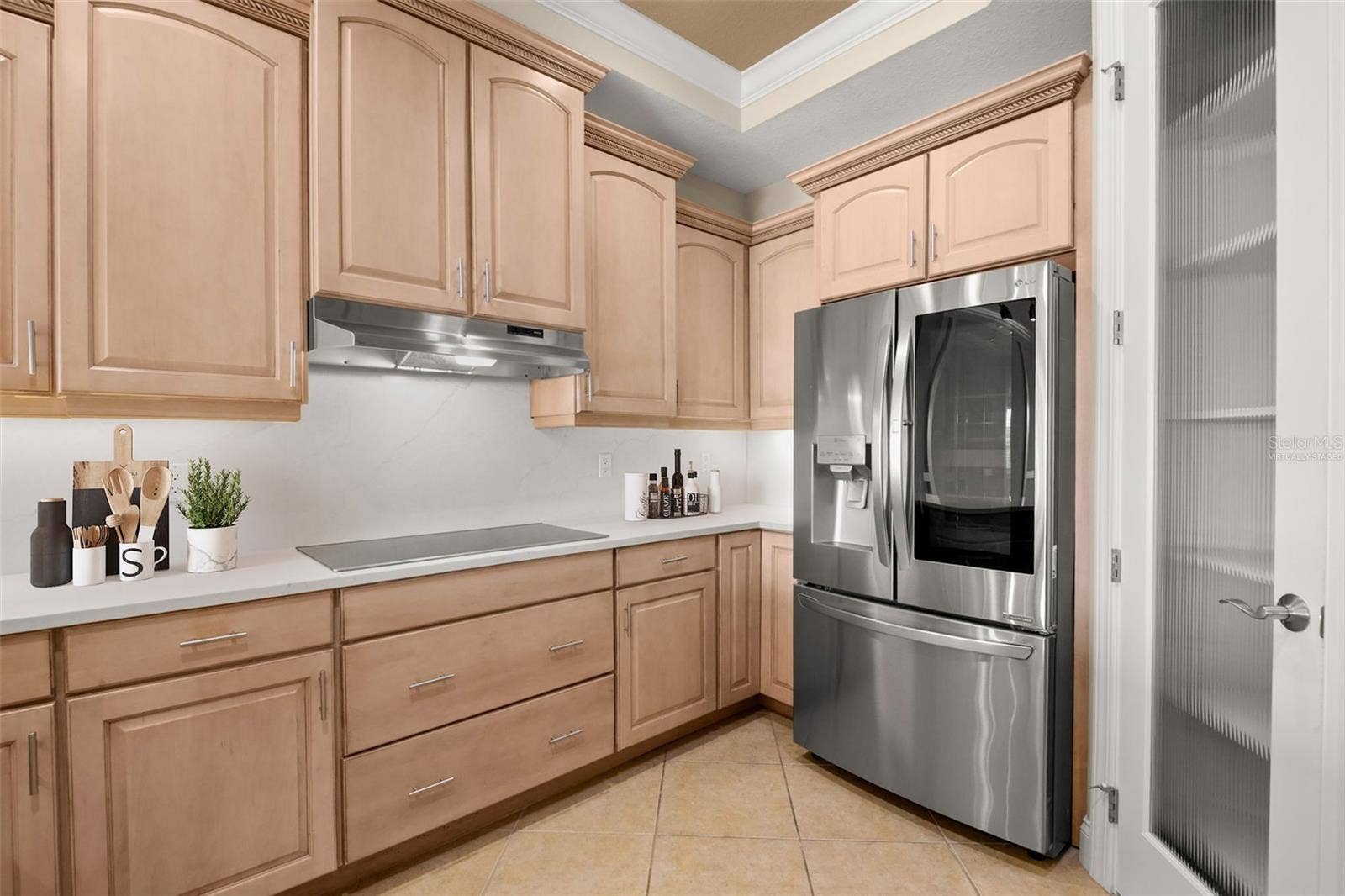 8 ACADEMY WAY S, #123, St Petersburg, FL 33711 Virtually staged; partial view of the Kitchen featuring extensive counter space.