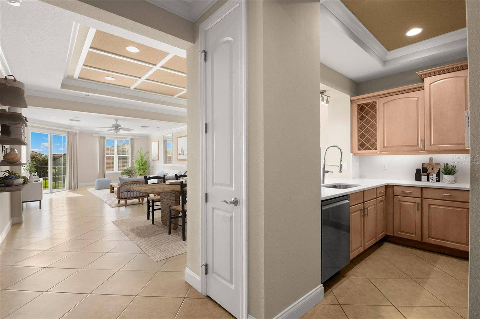 8 ACADEMY WAY S, #123, St Petersburg, FL 33711 Virtually staged; approaching Kitchen with Dining Room, Living Room and covered Terrace access.
