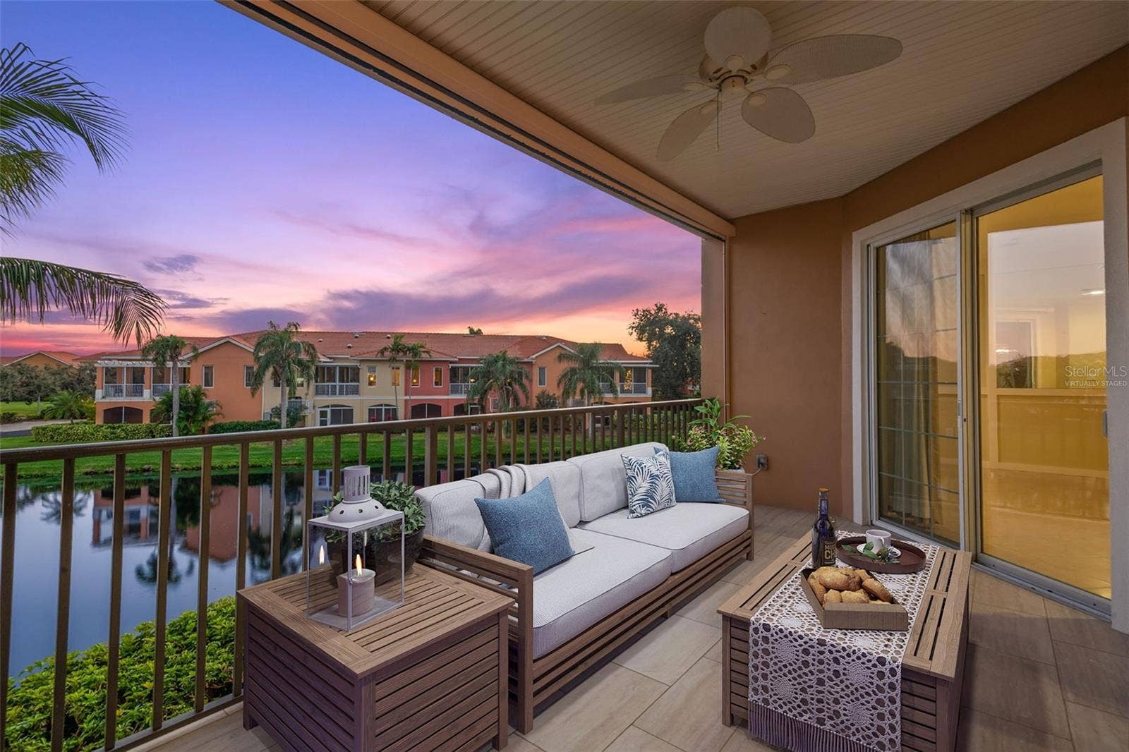8 ACADEMY WAY S, #123, St Petersburg, FL 33711 Virtually staged; Enjoy endless hours of sunset and sunrise views on Covered Terrace. Note retractable roll-down screen feature.