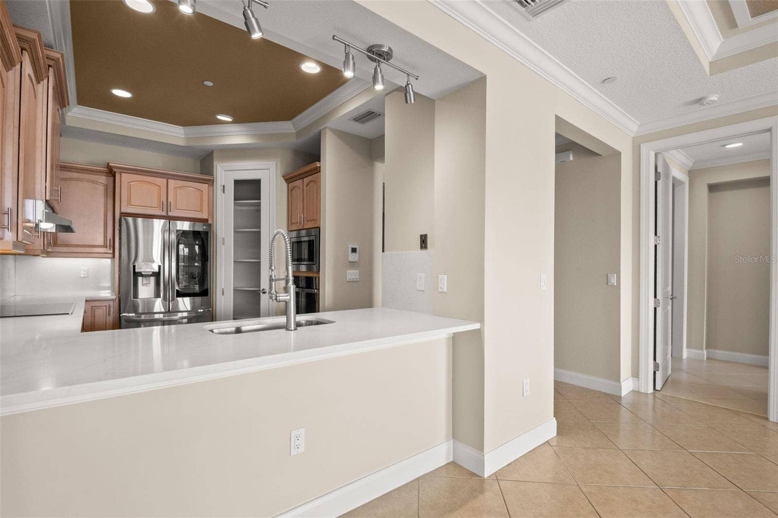 8 ACADEMY WAY S, #123, St Petersburg, FL 33711 Looking into Kitchen from Dining Room area.