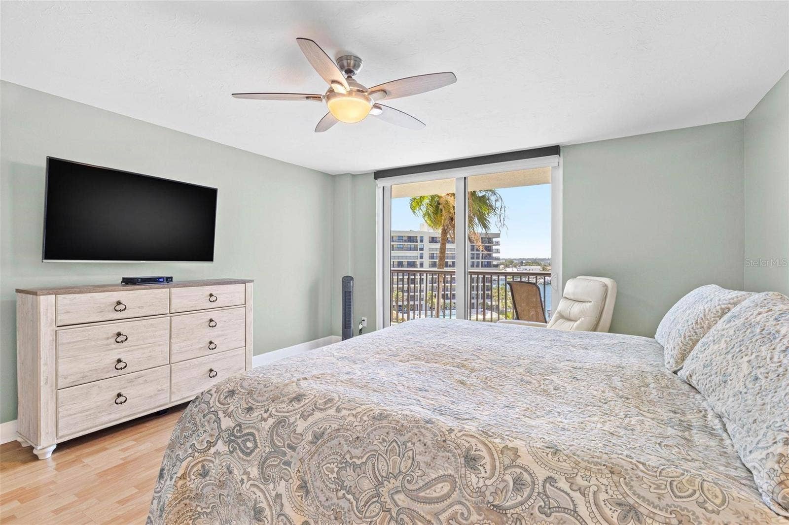 1660 GULF BOULEVARD, #607, Clearwater Beach, FL 33767 primary bedroom with bathroom en suite, water view and balcony