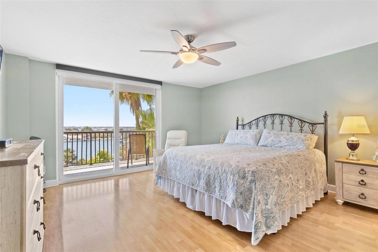 1660 GULF BOULEVARD, #607, Clearwater Beach, FL 33767 primary bedroom with bathroom en suite, water view and balcony